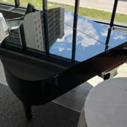 Baby Grand Piano with Sky reflection at Winnipeg Squash Racquet Club
