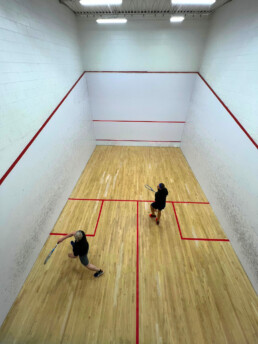 Overhead view of two squash players at Winnipeg Squash Racquet Club